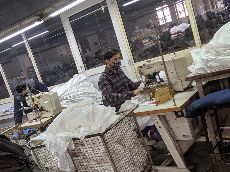 Automated buttonhole and rivet attachment machinery